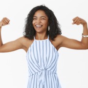 entrepreneur woman holding up arms to reflect strength